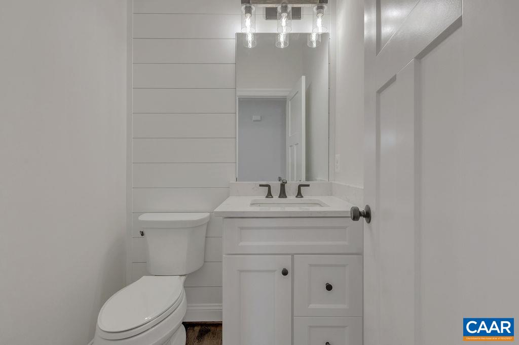 3 Rothwell Lane, Unit LOT 3 Crozet, VA 22932 - Photo 13 of 33 a bathroom with a sink a toilet and mirror