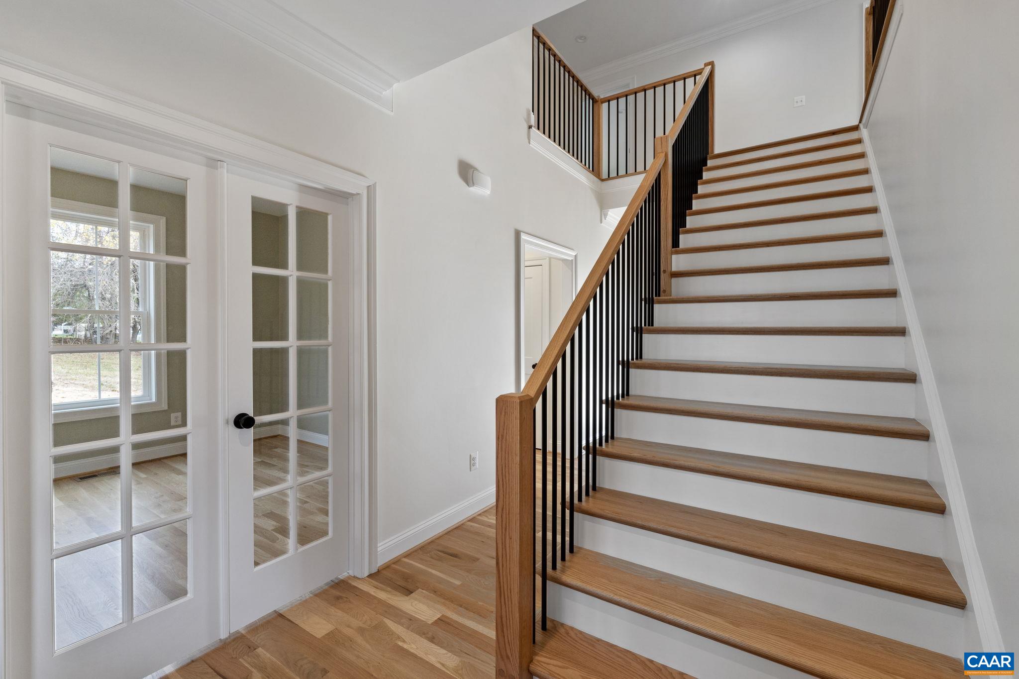 3 Rothwell Lane, Unit LOT 3 Crozet, VA 22932 - Photo 16 of 33 a view of entryway with wooden floor and stairs