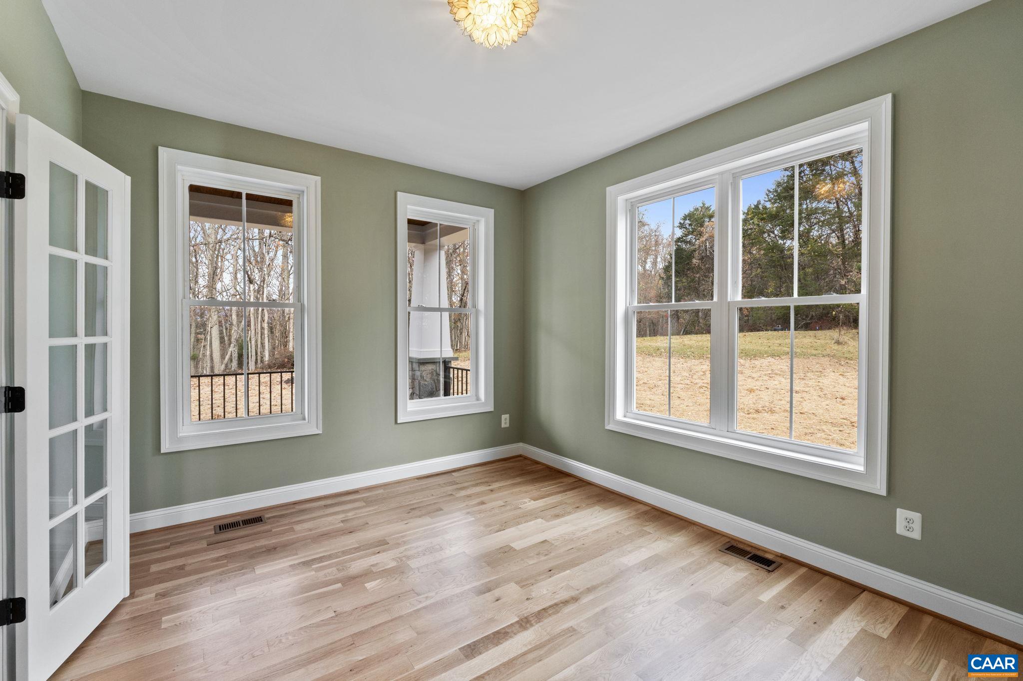 3 Rothwell Lane, Unit LOT 3 Crozet, VA 22932 - Photo 17 of 33 a view of an empty room with a window and wooden floor