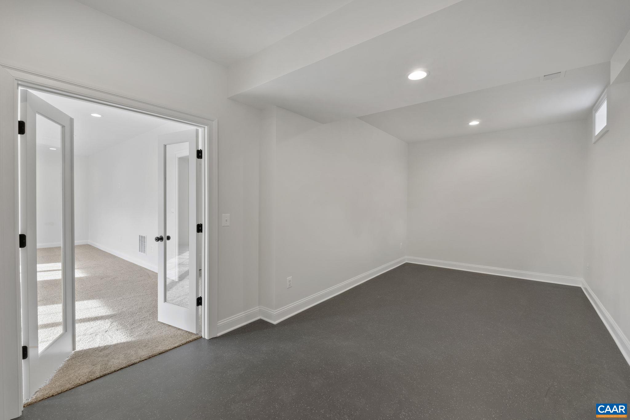 3 Rothwell Lane, Unit LOT 3 Crozet, VA 22932 - Photo 24 of 33 an empty room with sliding glass door and shower