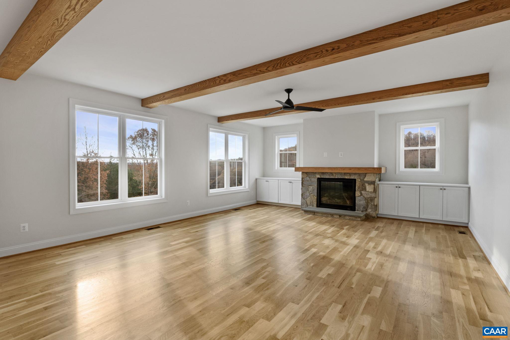 3 Rothwell Lane, Unit LOT 3 Crozet, VA 22932 - Photo 6 of 33 a view of an empty room with a window and fireplace