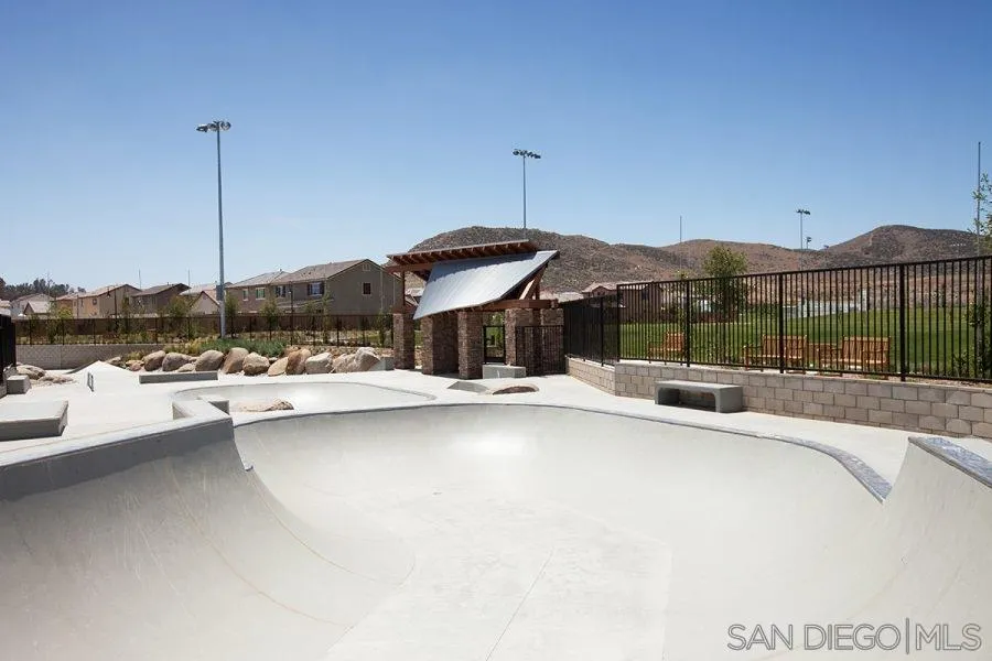 24384 Crooked Trail Menifee, CA 92584 - Photo 19 of 21 a view of a house with a yard and sitting area