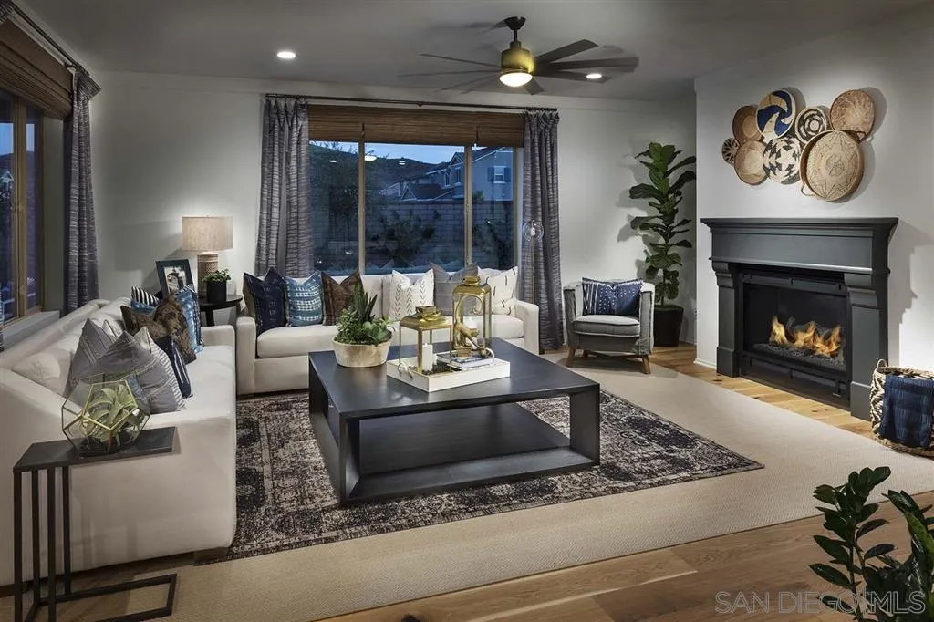 24384 Crooked Trail Menifee, CA 92584 - Photo 4 of 21 a living room with furniture and a fireplace
