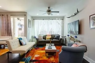 a living room with furniture and a large window