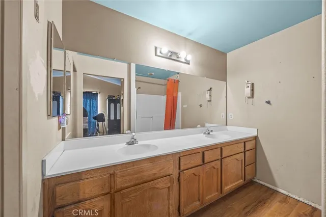 a bathroom with a sink and a mirror