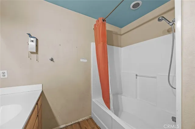 a bathroom with a bathtub and a shower