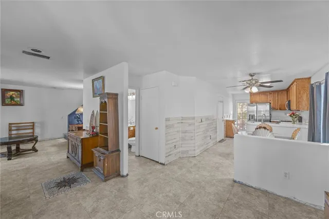 a view of a livingroom with workspace and a couch