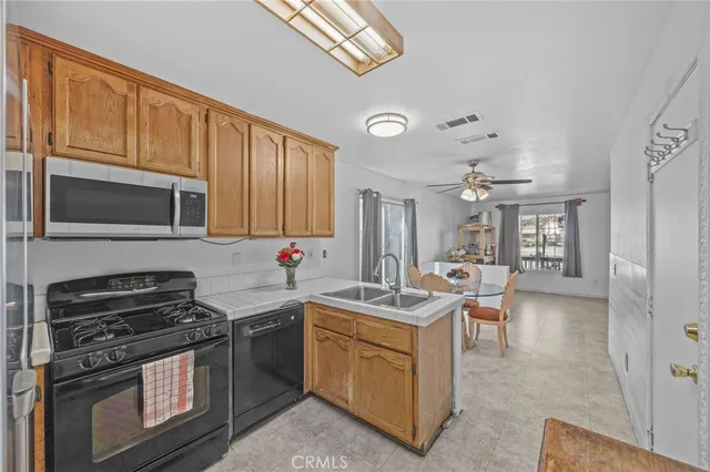 a kitchen with a stove sink and microwave