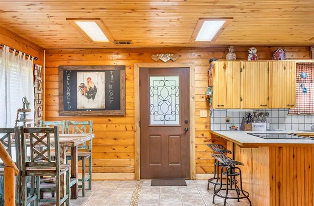 a bathroom with a sink a mirror and next to a window