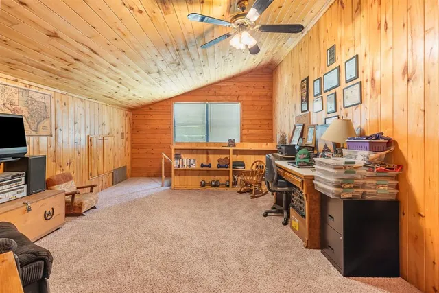 a view of a livingroom with furniture and a kitchen