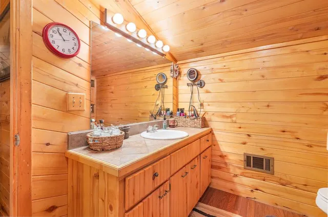a bathroom with a sink and a mirror