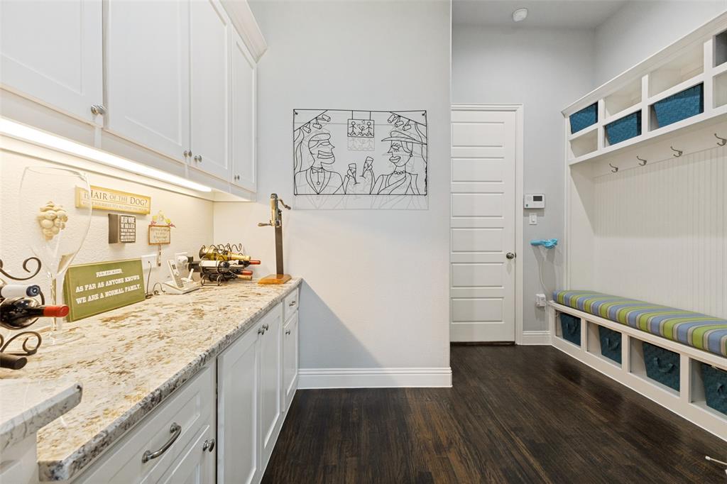 506 Life Spring Drive Rockwall, TX 75087 - Photo 16 of 36 a kitchen with granite countertop a refrigerator and a sink
