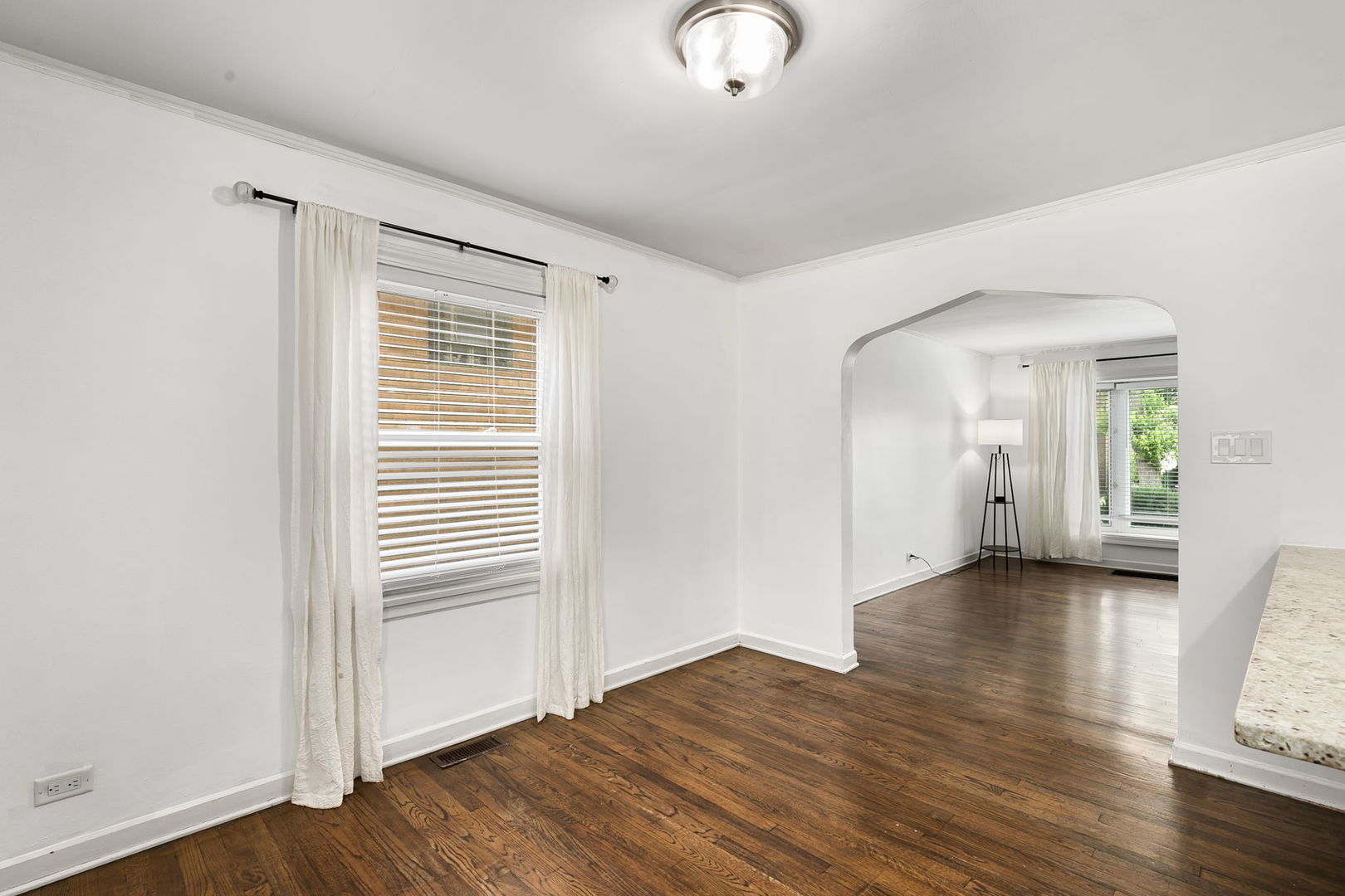 4237 Park Avenue Brookfield, IL 60513 - Photo 5 of 20 an empty room with wooden floor and windows