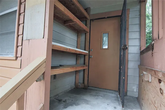 a view of an entryway with a hallway