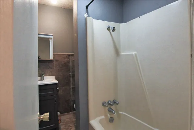 a bathroom with a sink and mirror