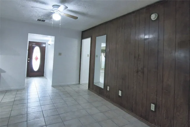 wooden floor in an empty room with a mirror