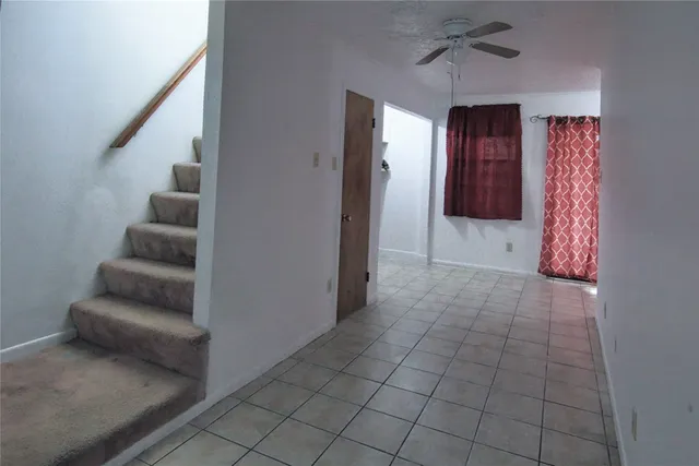 a view of an entryway with chandelier in hallway