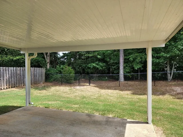 a view of backyard with green space
