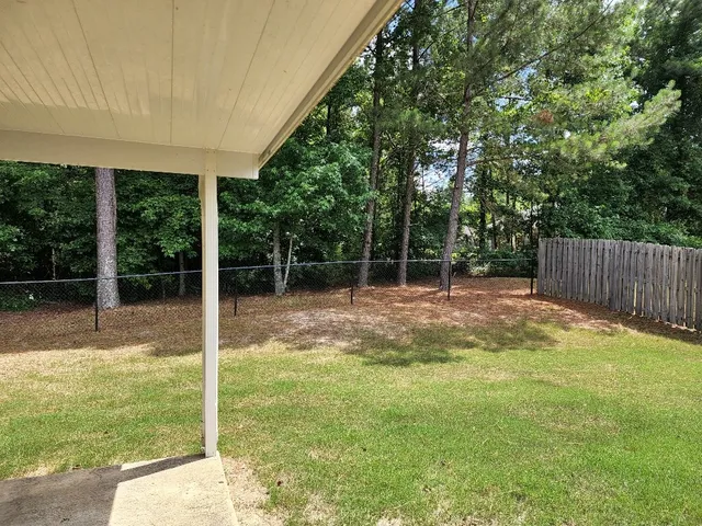a view of backyard with green space