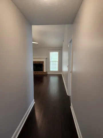 a view of gallery with wooden floor