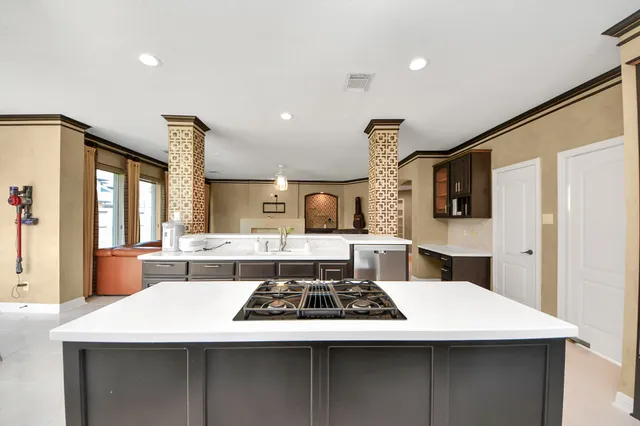 a kitchen with a stove and a sink