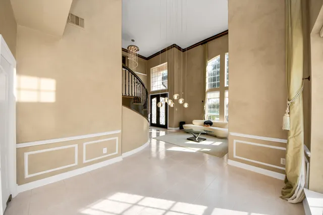 a view of a living room with a large window