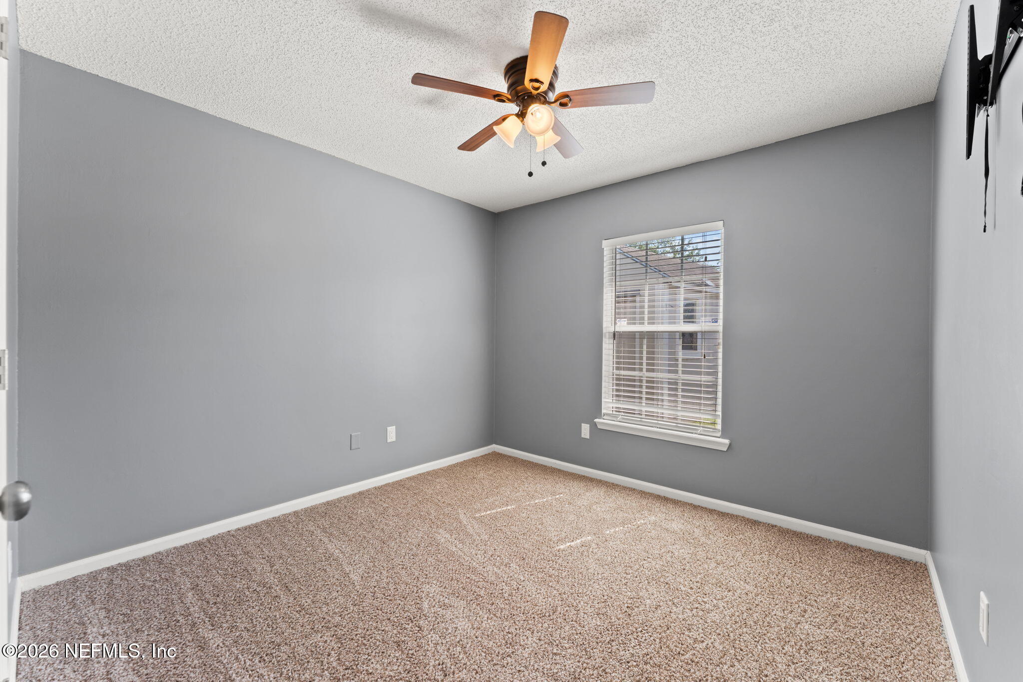 2982 Chief Ridaught Trail Middleburg, FL 32068 - Photo 24 of 29 an empty room with windows and fan