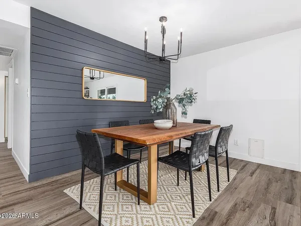 a dining room with furniture and window