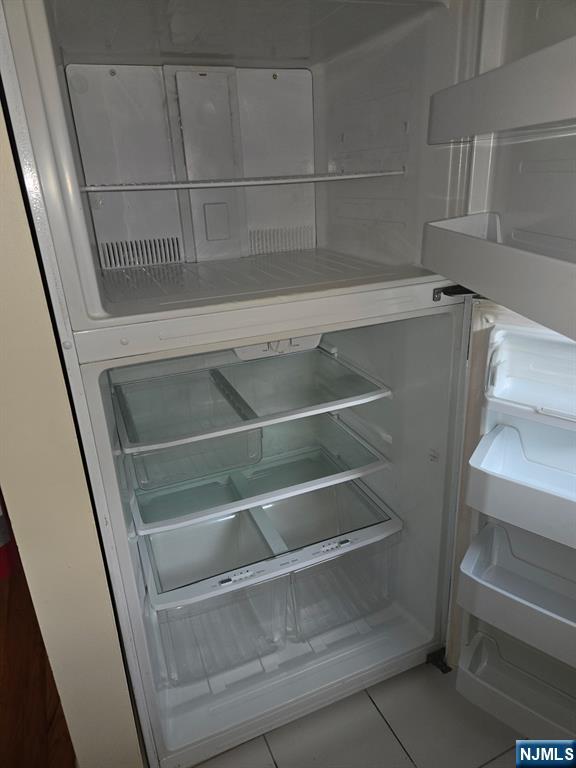 275 River Road, Unit K Bogota, NJ 07603 - Photo 6 of 8 a view of walk in closet with empty racks