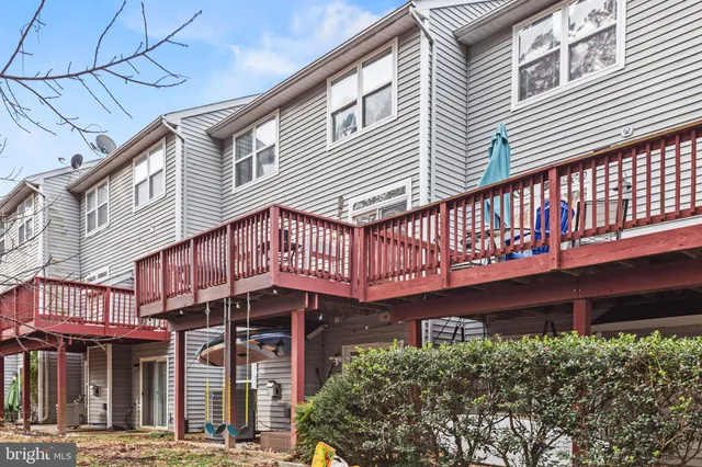 a view of a house with wooden deck