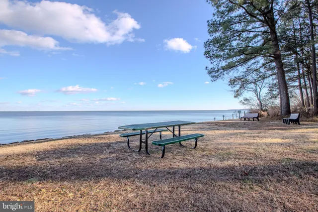 a view of an ocean beach and mountain