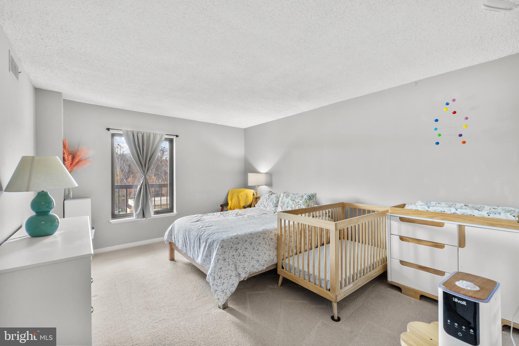 4500 South Four Mile Run Drive, Unit 222 Arlington, VA 22204 - Photo 15 of 41 a bedroom with furniture and a window