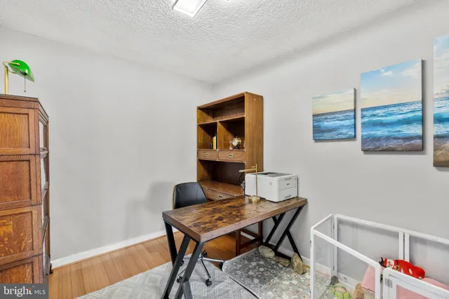 a workspace with furniture and window