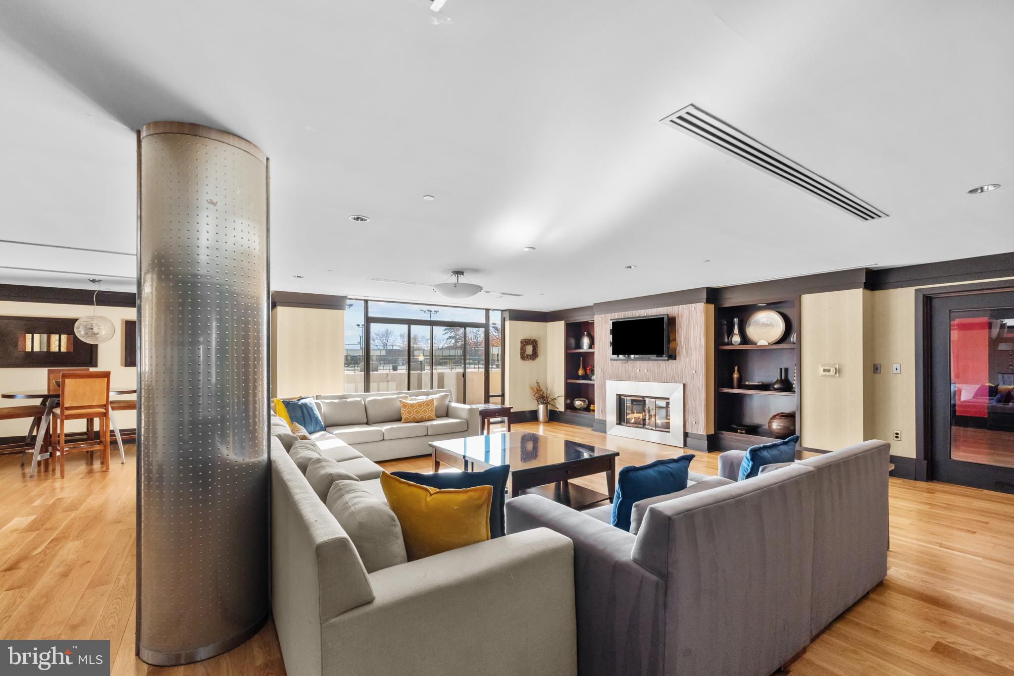 4500 South Four Mile Run Drive, Unit 222 Arlington, VA 22204 - Photo 28 of 41 a living room with furniture and a flat screen tv