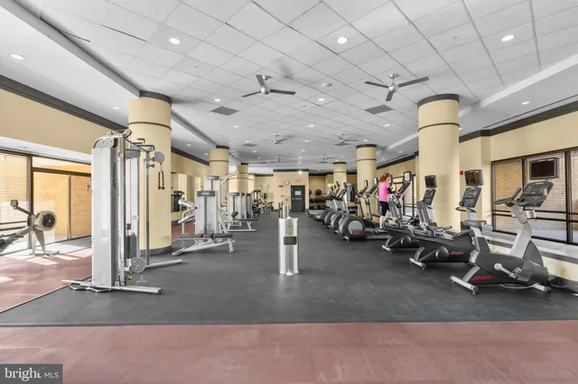 a view of a pool with chairs
