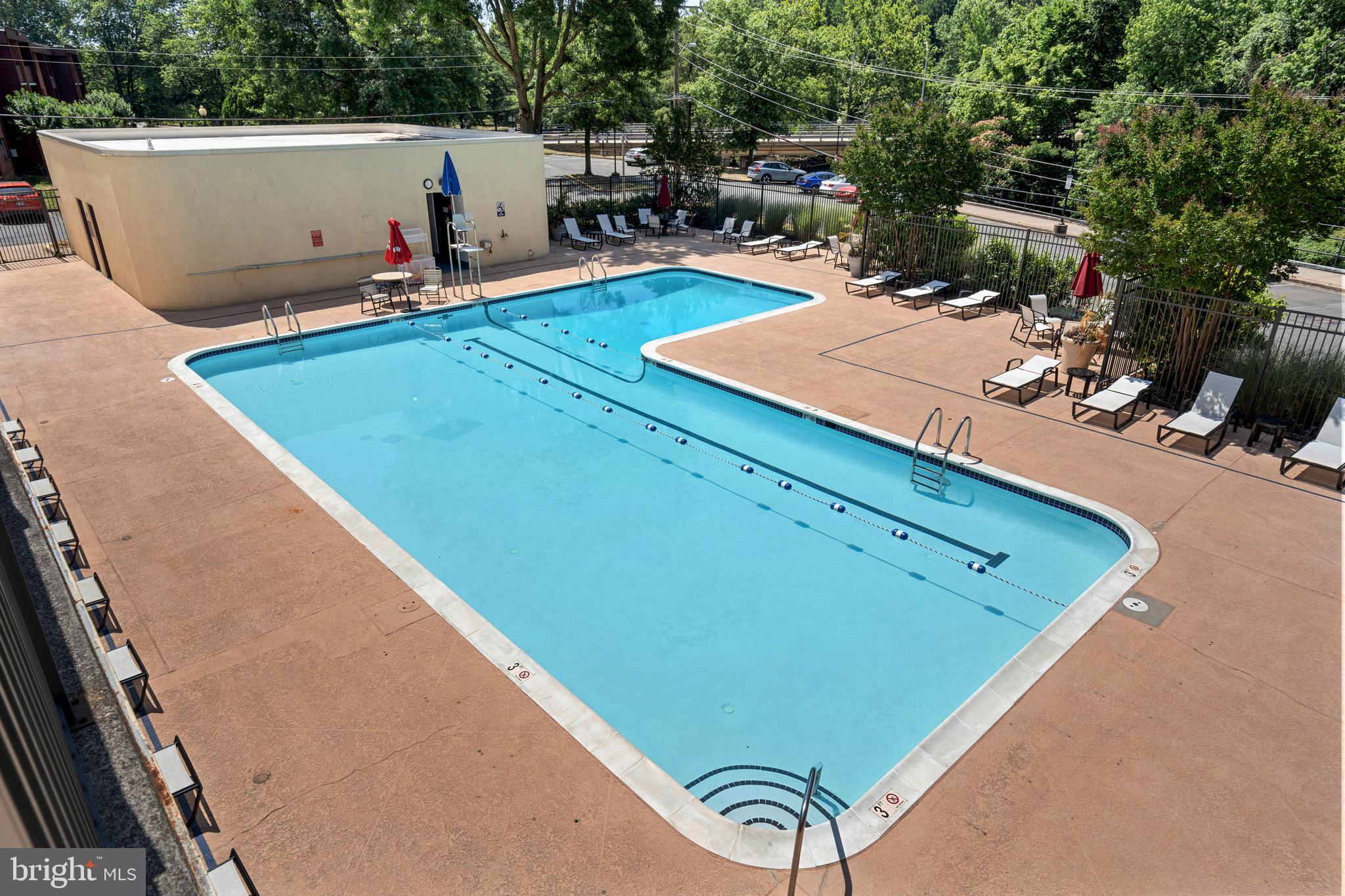 4500 South Four Mile Run Drive, Unit 222 Arlington, VA 22204 - Photo 31 of 41 a view of a pool with chairs
