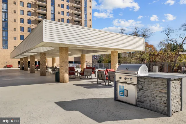 a view of a tall building with a tall trees