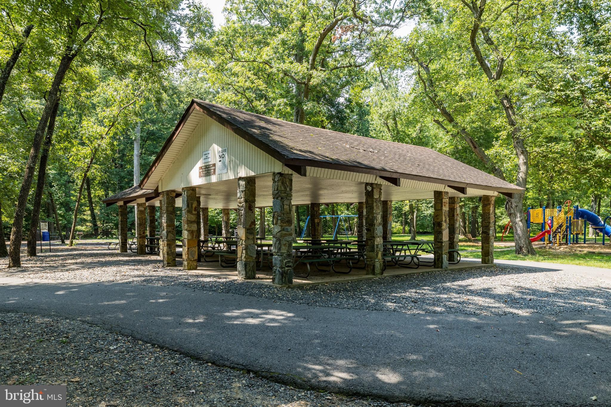 4500 South Four Mile Run Drive, Unit 222 Arlington, VA 22204 - Photo 38 of 41 a front view of a house with a yard