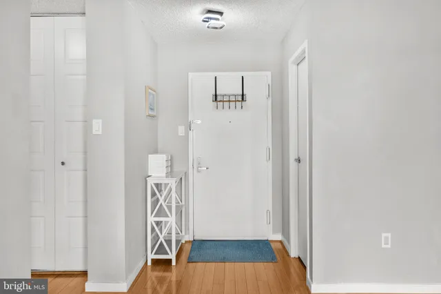 a view of front door with wooden floor