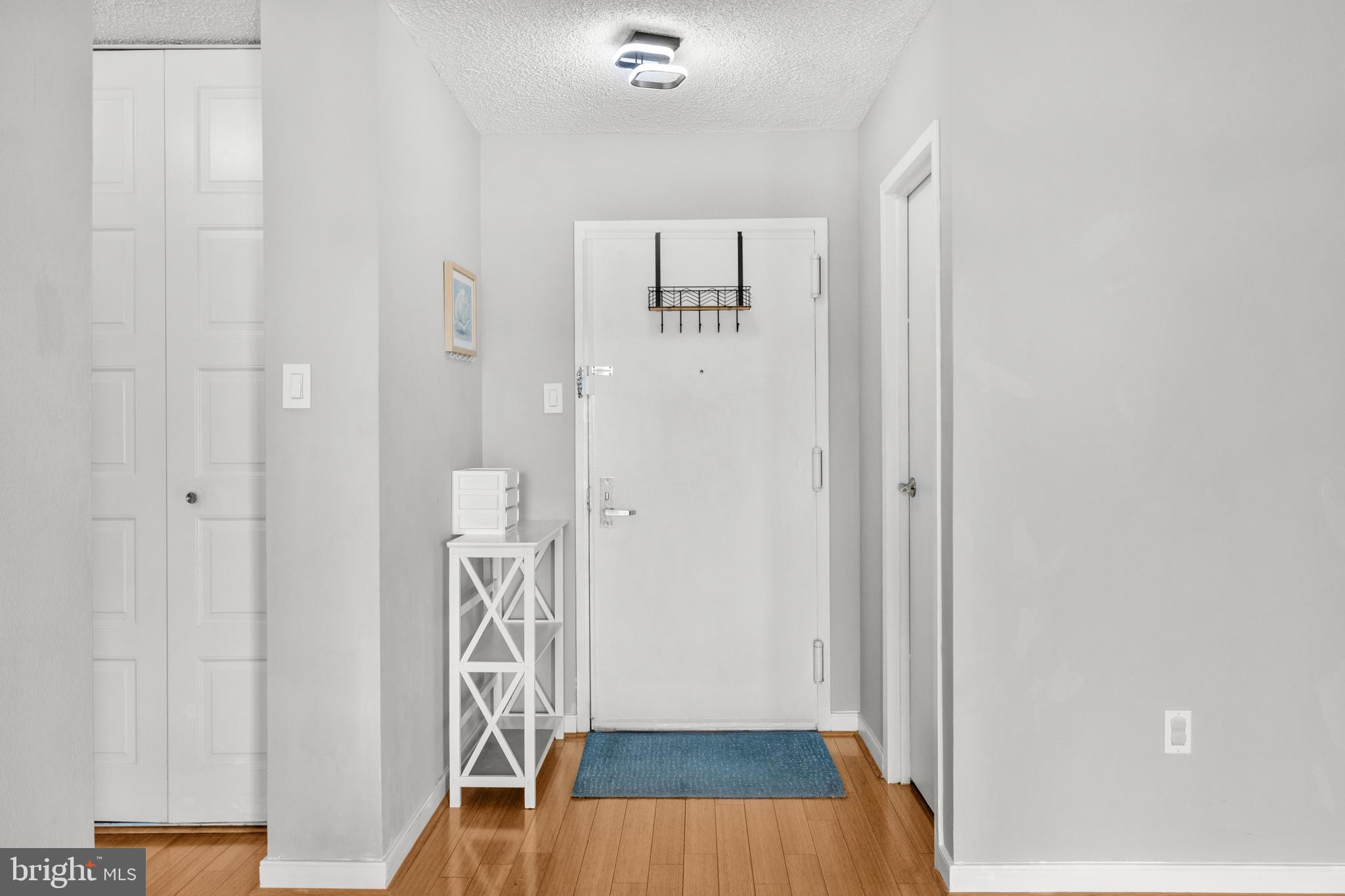4500 South Four Mile Run Drive, Unit 222 Arlington, VA 22204 - Photo 6 of 41 a view of front door with wooden floor