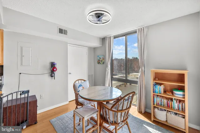 a view of a livingroom with furniture and a window
