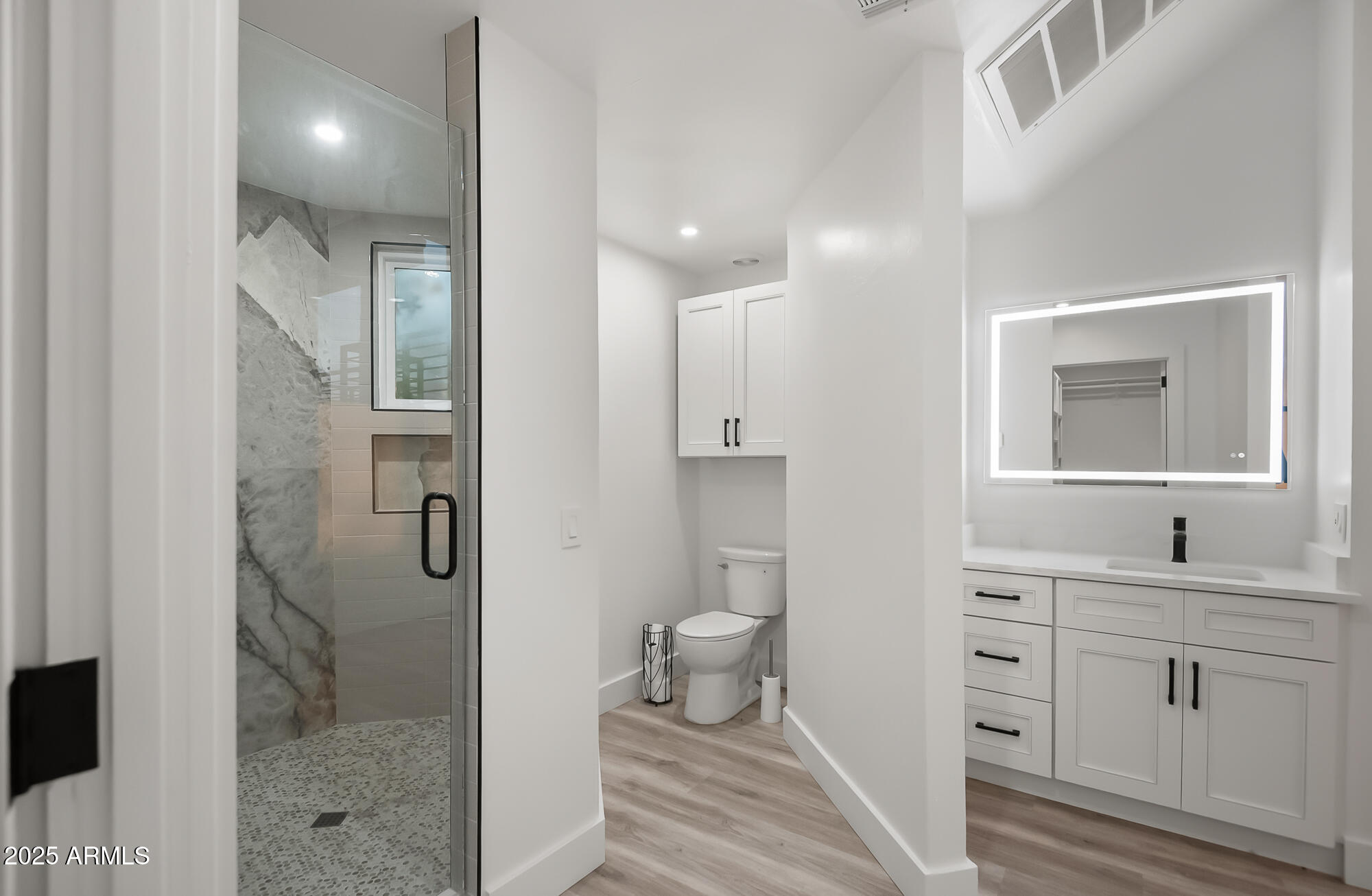 13428 North 16th Place Phoenix, AZ 85022 - Photo 14 of 29 a bathroom with a double vanity sink toilet and shower