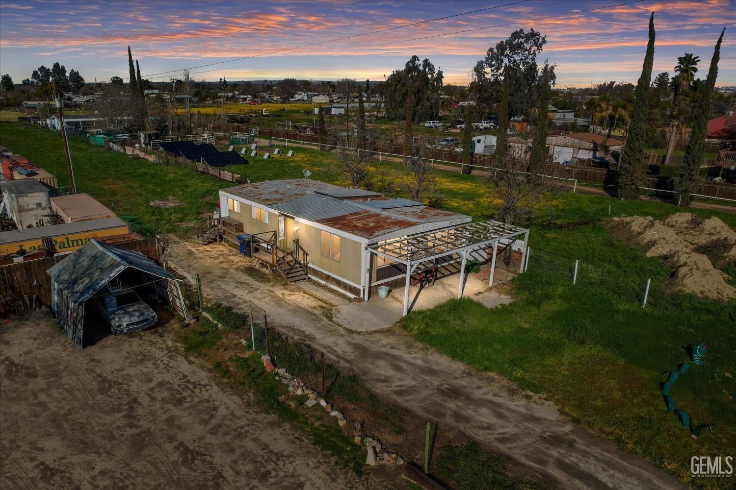 a view of a backyard with a garden and plants