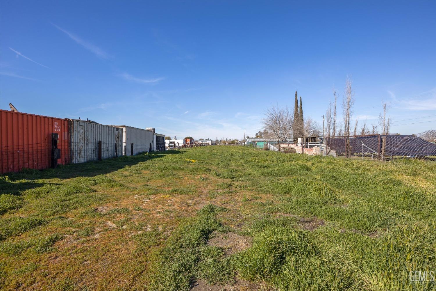 Undisclosed Address Bakersfield, CA 93312 - Photo 15 of 26 a view of a big yard next to a building