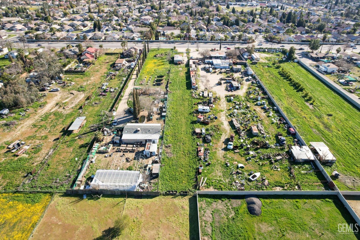 Undisclosed Address Bakersfield, CA 93312 - Photo 21 of 26 an aerial view of residential houses with outdoor space
