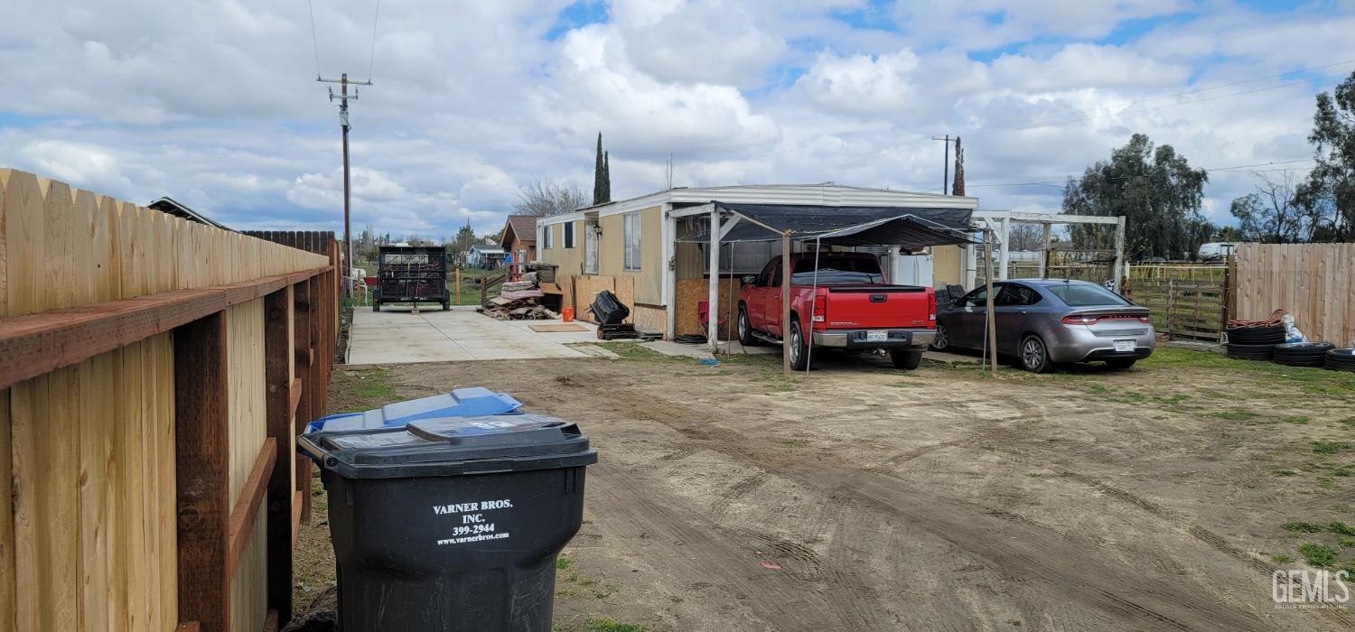Undisclosed Address Bakersfield, CA 93312 - Photo 3 of 26 a car parked in front of a house