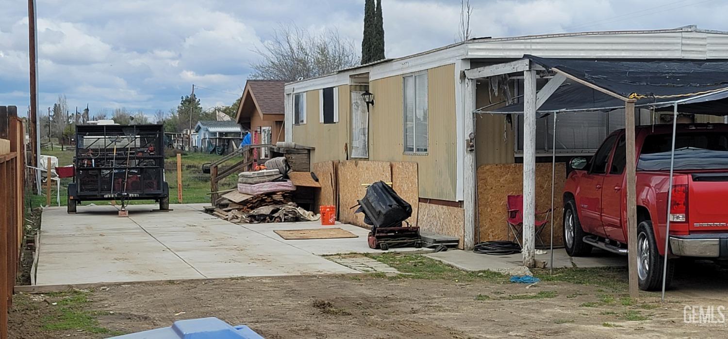 Undisclosed Address Bakersfield, CA 93312 - Photo 4 of 26 a view of a garage with cars