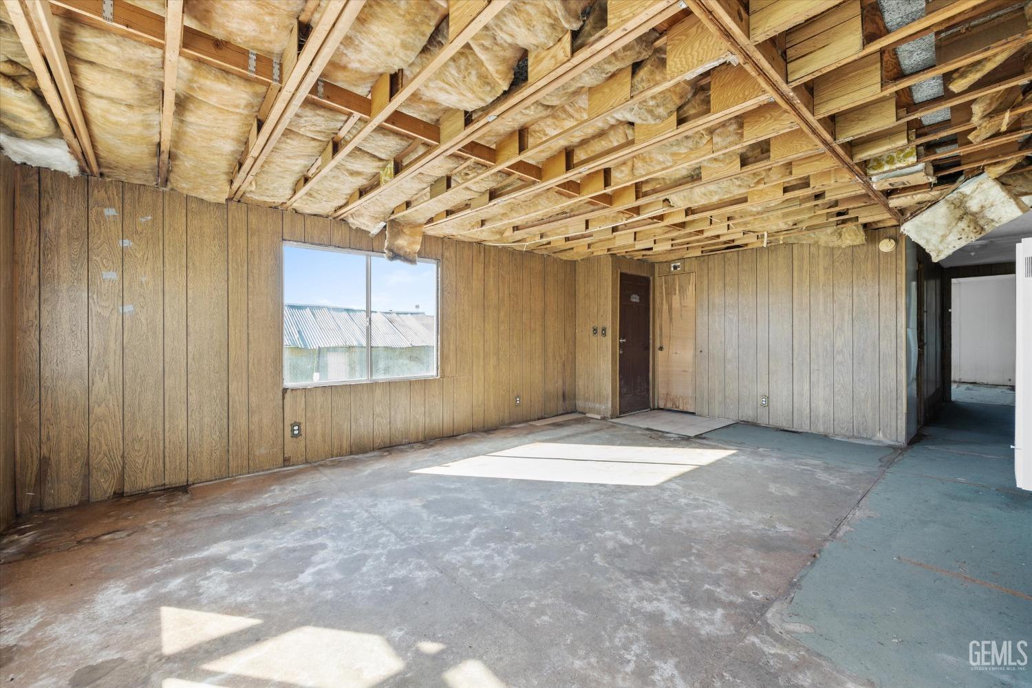 Undisclosed Address Bakersfield, CA 93312 - Photo 7 of 26 a view of an empty room with windows
