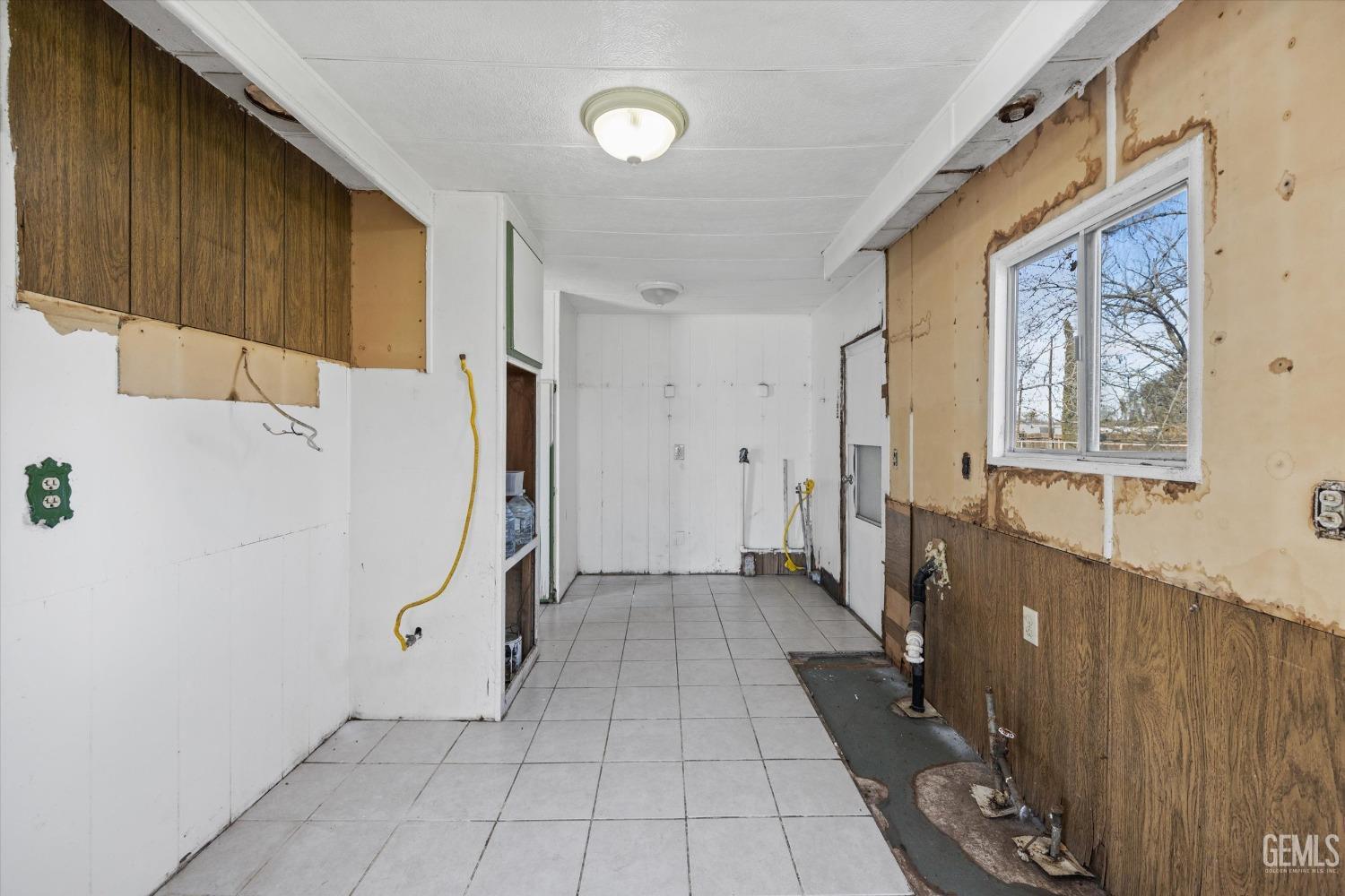 Undisclosed Address Bakersfield, CA 93312 - Photo 9 of 26 a view of a hallway with windows