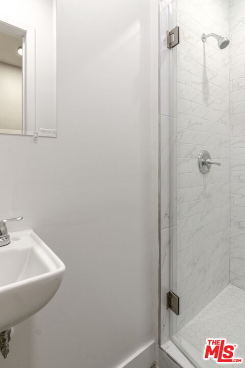 2302 Bagley Avenue Los Angeles, CA 90034 - Photo 12 of 20 a bathroom with a shower and sink